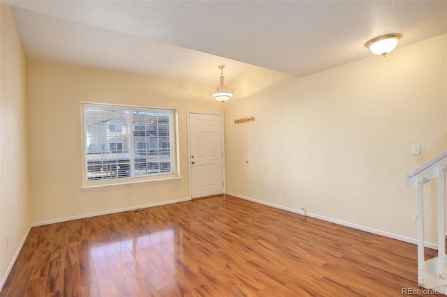 spare room featuring hardwood / wood-style floors