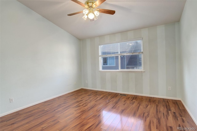 unfurnished room with ceiling fan and hardwood / wood-style flooring