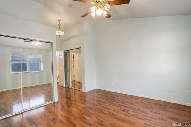 unfurnished bedroom featuring hardwood / wood-style flooring, ceiling fan, and a closet