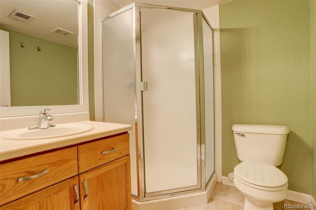 bathroom with toilet, tile patterned floors, walk in shower, and vanity