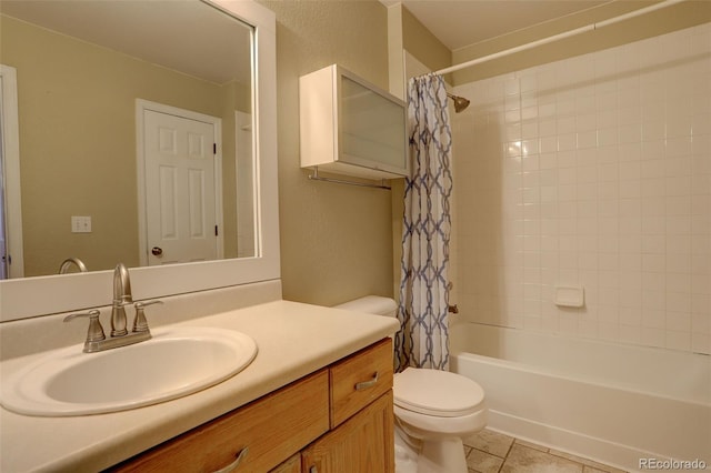 full bathroom with toilet, tile patterned floors, shower / tub combo with curtain, and vanity