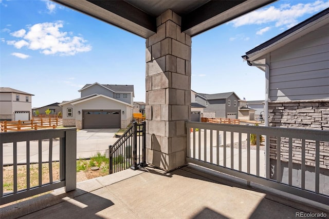 3314 N Haleyville Ct, Aurora, CO 80019 - view of patio / terrace with a residential view, a balcony, and a detached garage