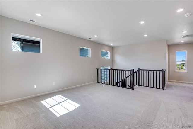 3314 N Haleyville Ct, Aurora, CO 80019 - spare room with light colored carpet, baseboards, a smoke detector, and recessed lighting