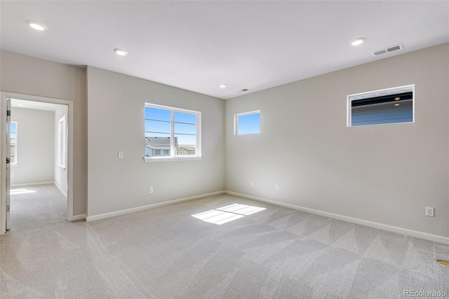 3314 N Haleyville Ct, Aurora, CO 80019 - empty room with light colored carpet, baseboards, and recessed lighting