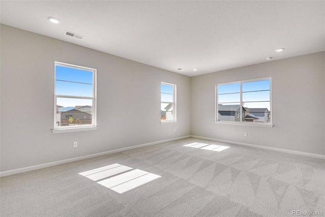 3314 N Haleyville Ct, Aurora, CO 80019 - spare room with light colored carpet, baseboards, and recessed lighting