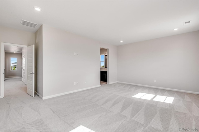 3314 N Haleyville Ct, Aurora, CO 80019 - empty room with light colored carpet, baseboards, and recessed lighting
