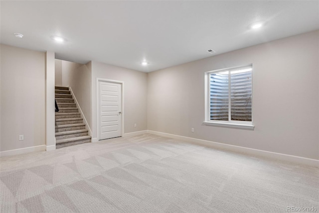 3314 N Haleyville Ct, Aurora, CO 80019 - below grade area featuring stairs, recessed lighting, light colored carpet, and baseboards