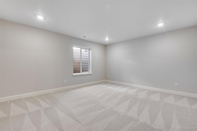 3314 N Haleyville Ct, Aurora, CO 80019 - spare room with light colored carpet, recessed lighting, and baseboards