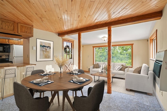 109 Cutforth Rd, Black Hawk, CO 80422 - dining area featuring light carpet and a wood ceiling with exposed beams