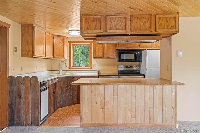 109 Cutforth Rd, Black Hawk, CO 80422 - kitchen with black microwave, electric range oven, freestanding refrigerator, wood ceiling, and light countertops