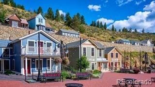 109 Cutforth Rd, Black Hawk, CO 80422 - back of property featuring a balcony and a residential view