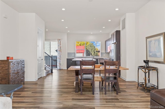 dining area with dark wood-style flooring, visible vents, and recessed lighting