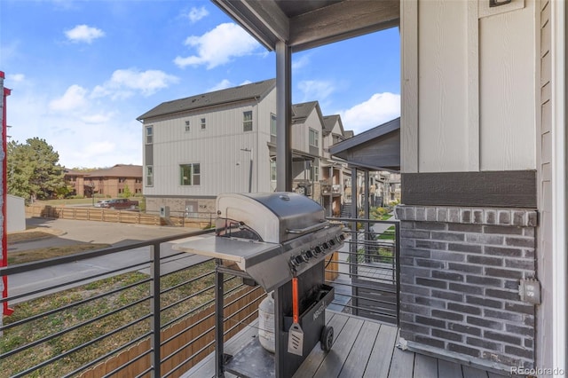 balcony with a residential view and area for grilling