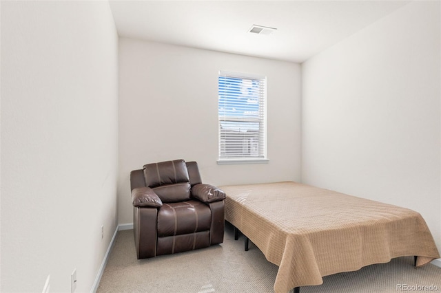 bedroom with carpet, visible vents, and baseboards