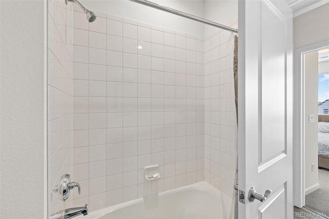 ensuite bathroom with shower / washtub combination and connected bathroom