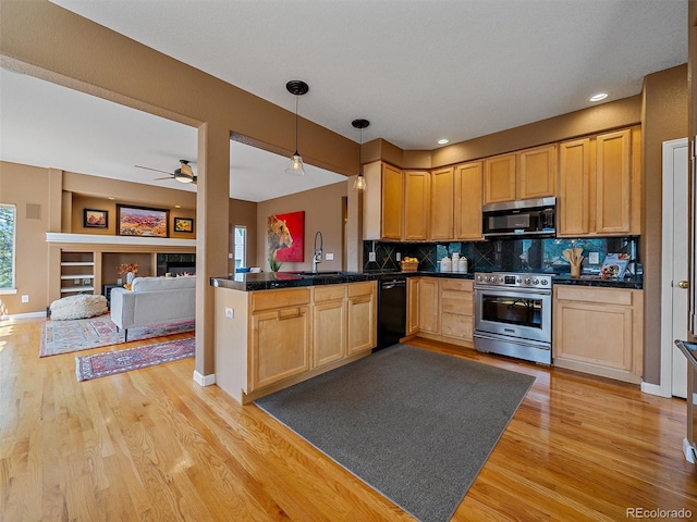 3173 Gold Yarrow Ln, Evergreen, CO 80439 - kitchen featuring light brown cabinetry, a sink, tasteful backsplash, light wood-type flooring, and appliances with stainless steel finishes