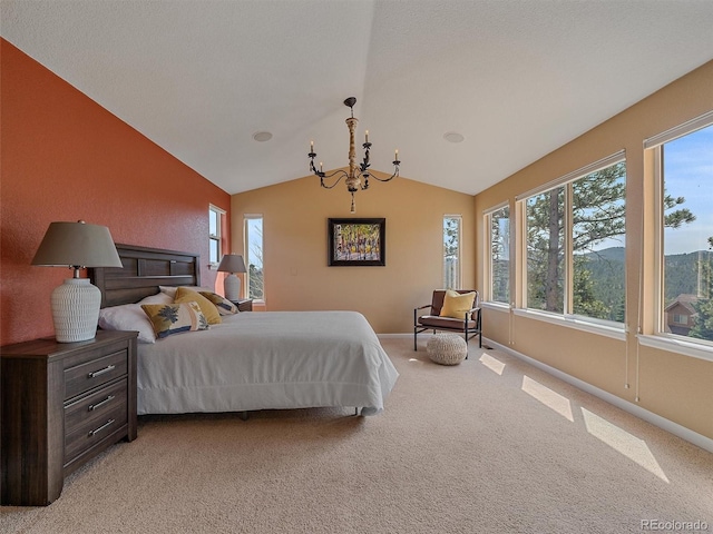 3173 Gold Yarrow Ln, Evergreen, CO 80439 - bedroom with baseboards, vaulted ceiling, light colored carpet, and an inviting chandelier