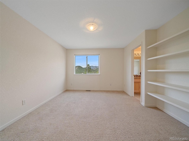 3173 Gold Yarrow Ln, Evergreen, CO 80439 - unfurnished bedroom with light carpet and baseboards