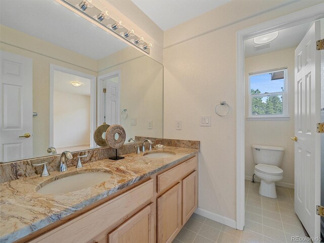 3173 Gold Yarrow Ln, Evergreen, CO 80439 - bathroom featuring tile patterned floors, a sink, visible vents, and double vanity