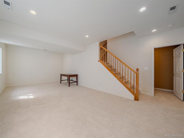 3173 Gold Yarrow Ln, Evergreen, CO 80439 - finished below grade area with stairway, recessed lighting, visible vents, and carpet