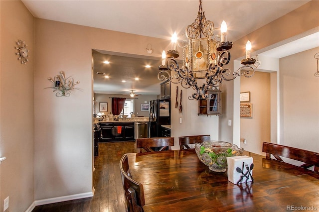25120 E Maple Pl, Aurora, CO 80018 - dining room with dark wood-type flooring and a chandelier
