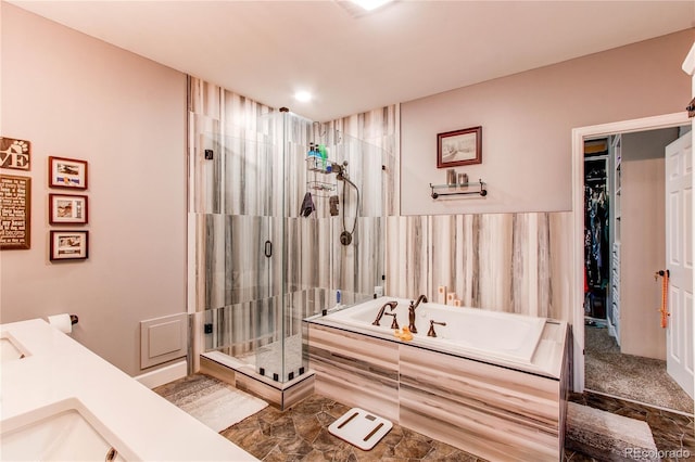 25120 E Maple Pl, Aurora, CO 80018 - bathroom featuring a bath, a stall shower, a spacious closet, and double vanity