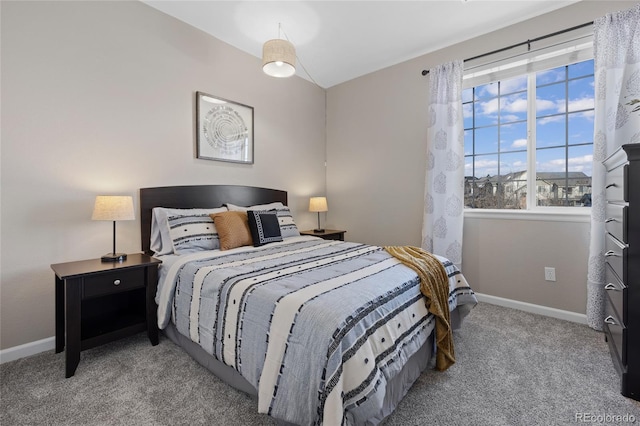 bedroom featuring carpet and baseboards