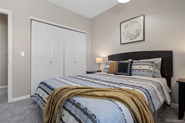 bedroom with baseboards, a closet, and carpet