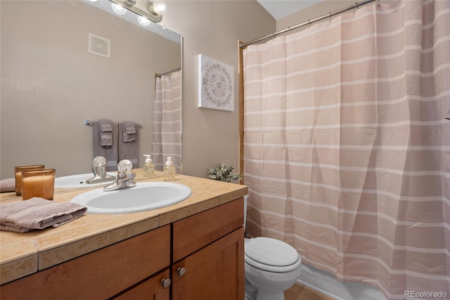full bathroom with toilet, visible vents, curtained shower, vanity, and a textured wall
