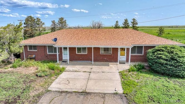 1614 N Manila Rd, Bennett, CO 80102 - ranch-style home with brick siding