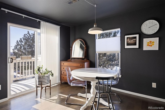 dining space featuring hardwood / wood-style flooring