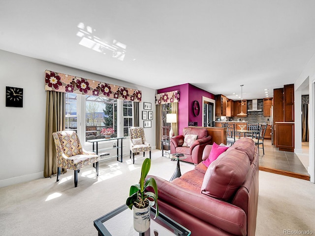 living room featuring recessed lighting, baseboards, and light carpet