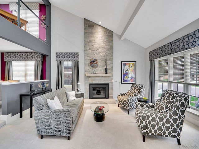 carpeted living room with a stone fireplace, a wealth of natural light, and high vaulted ceiling
