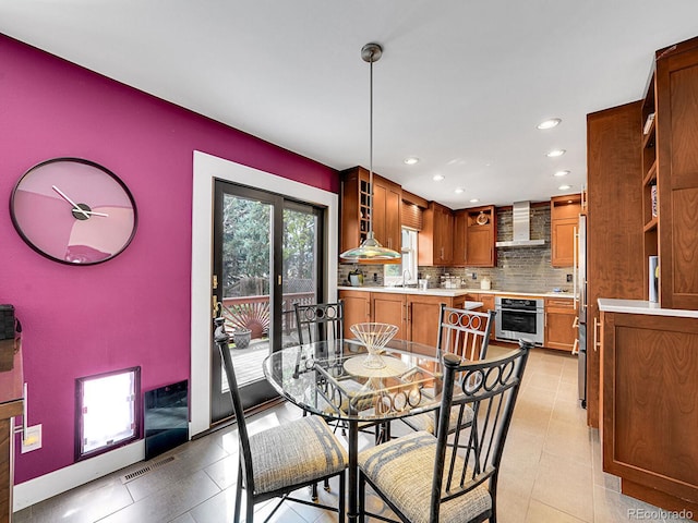 dining area with light tile patterned floors, recessed lighting, and visible vents