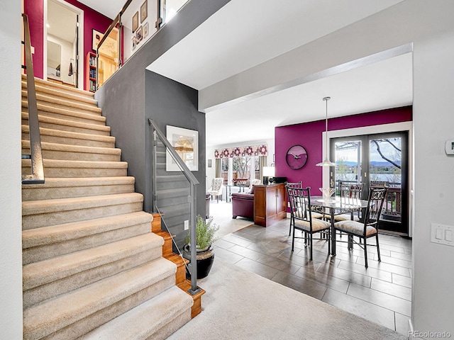 stairway with tile patterned flooring
