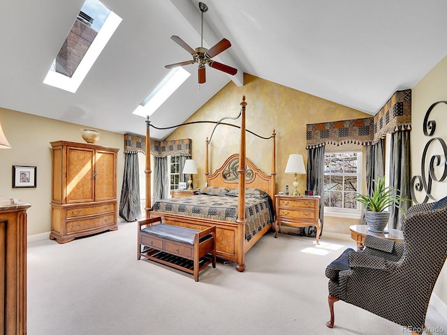 carpeted bedroom featuring baseboards, a skylight, beam ceiling, and high vaulted ceiling