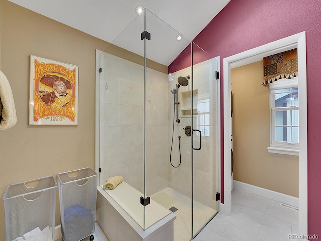 bathroom with visible vents, marble finish floor, baseboards, a shower stall, and vaulted ceiling