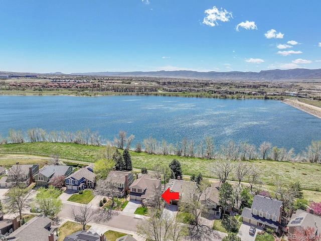 birds eye view of property featuring a residential view and a water and mountain view
