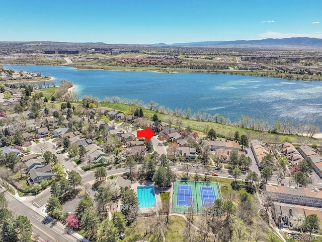 bird's eye view featuring a water and mountain view and a residential view
