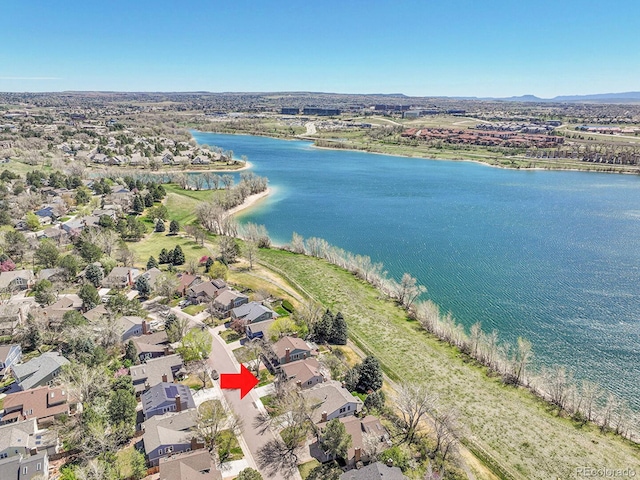 aerial view with a water view and a residential view