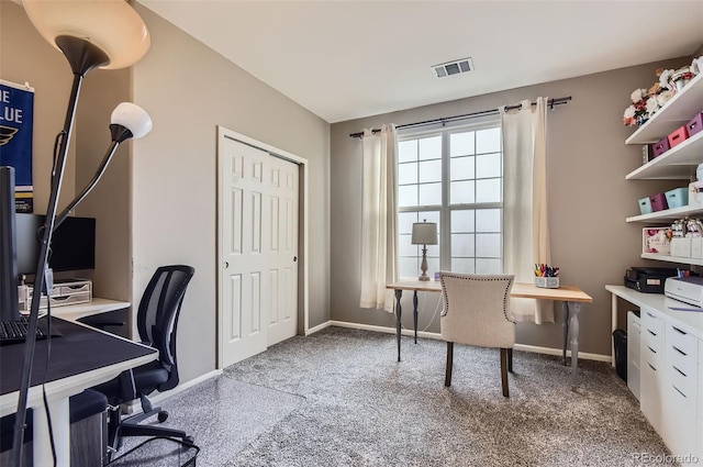 carpeted home office featuring baseboards and visible vents