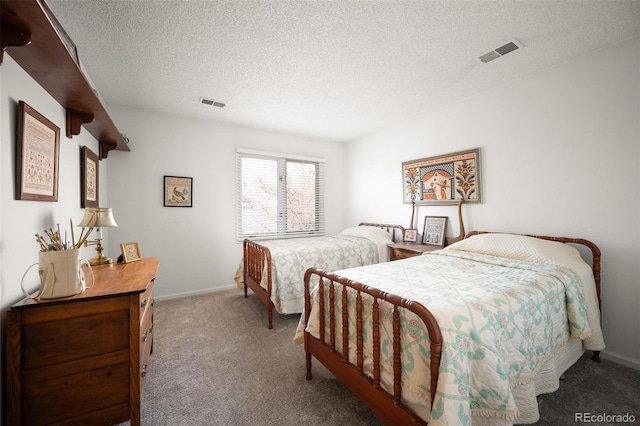 carpeted bedroom featuring a textured ceiling