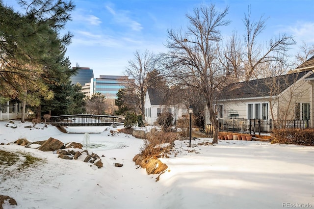 view of yard layered in snow