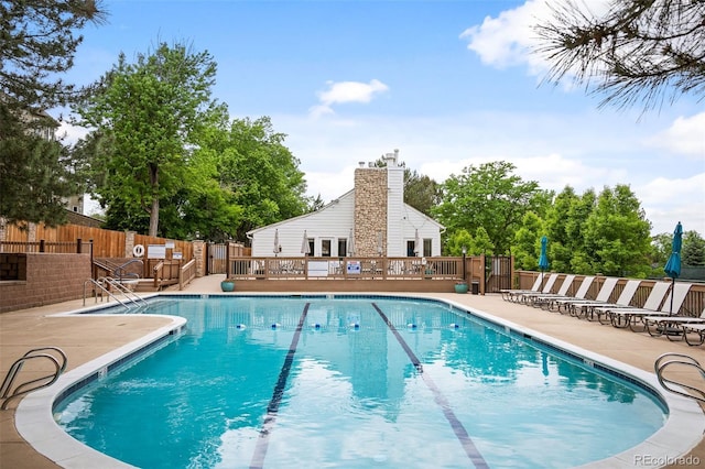 view of swimming pool with a patio area