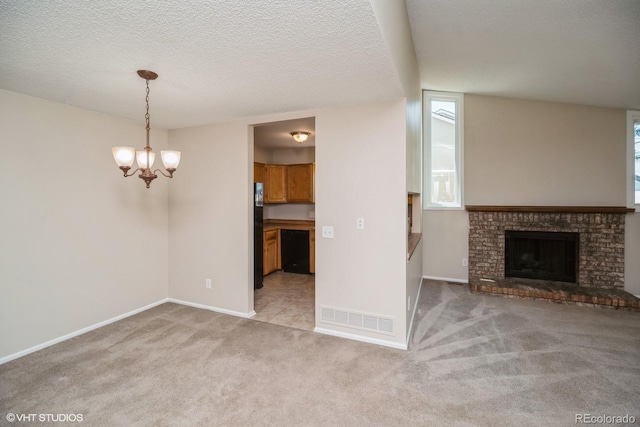 7325 S Houstoun Waring Cir, Littleton, CO 80120 - unfurnished living room featuring a chandelier, light carpet, a brick fireplace, and a textured ceiling
