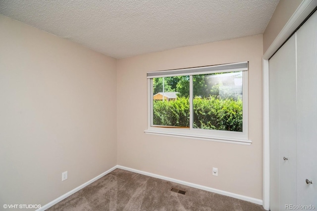 7325 S Houstoun Waring Cir, Littleton, CO 80120 - unfurnished bedroom with a closet, carpet flooring, and a textured ceiling