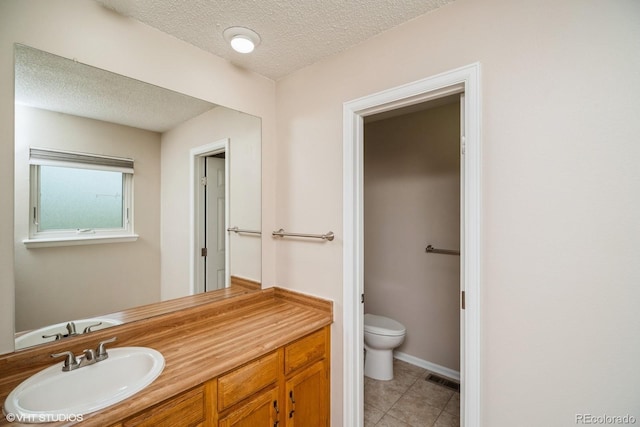 7325 S Houstoun Waring Cir, Littleton, CO 80120 - bathroom featuring a textured ceiling, vanity, and tile patterned flooring
