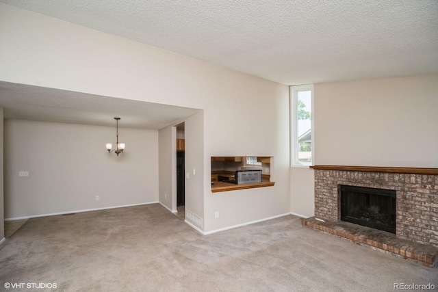 7325 S Houstoun Waring Cir, Littleton, CO 80120 - unfurnished living room featuring a chandelier, a fireplace, and carpet