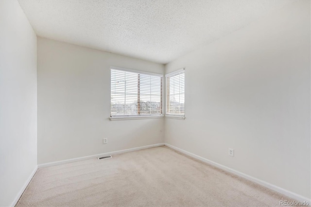 4290 Cottonwood Lakes Blvd, Thornton, CO 80241 - carpeted empty room featuring a textured ceiling, visible vents, and baseboards