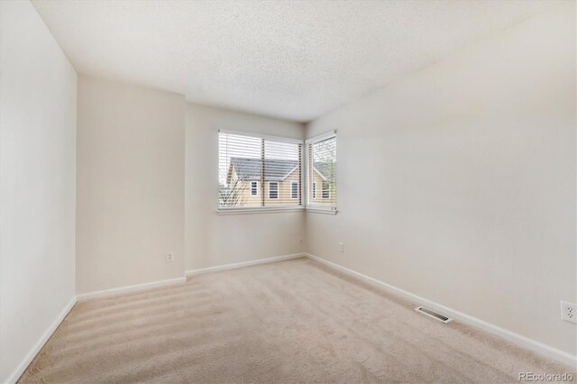 4290 Cottonwood Lakes Blvd, Thornton, CO 80241 - spare room with carpet flooring, a textured ceiling, baseboards, and visible vents